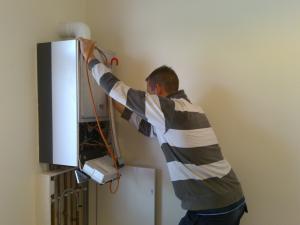 one of our Rockwall water heater repair techs fixing a unit